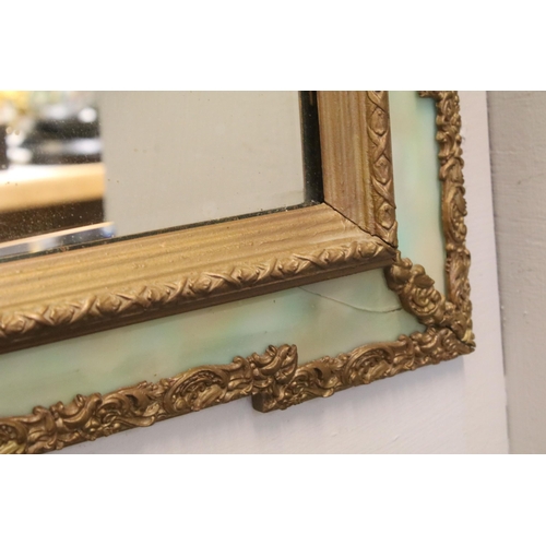 469 - 20th Century wall mirror of rectangular form with a bevelled glass panel to centre with green glass ... 