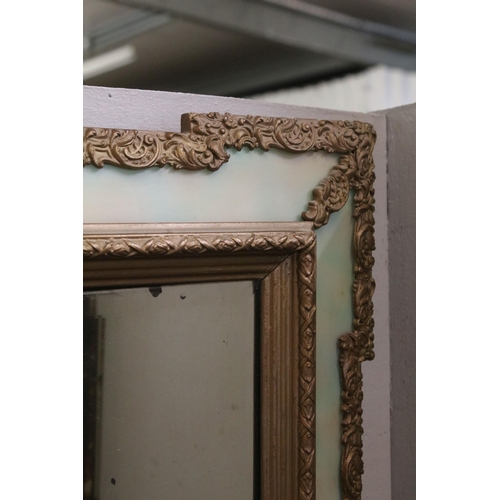 469 - 20th Century wall mirror of rectangular form with a bevelled glass panel to centre with green glass ... 