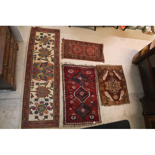 476 - Group of four rugs, one red ground example with three diamond pattern to centre, measures 124cm x 75... 