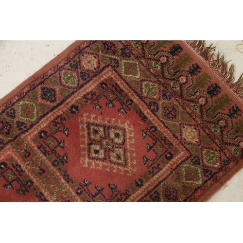 476 - Group of four rugs, one red ground example with three diamond pattern to centre, measures 124cm x 75... 