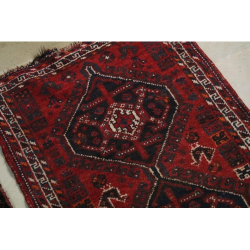 477 - Two rugs, one having blue ground with mixed colour border, burgundy diamond shape and white centre t... 