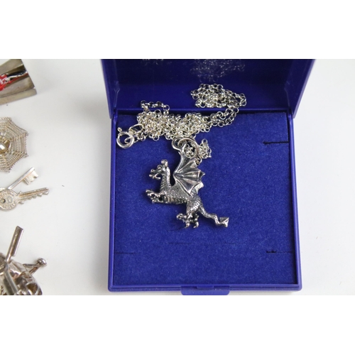 149A - Large collection of costume jewellery to include two silver charm bracelets, set of Guinness buttons... 