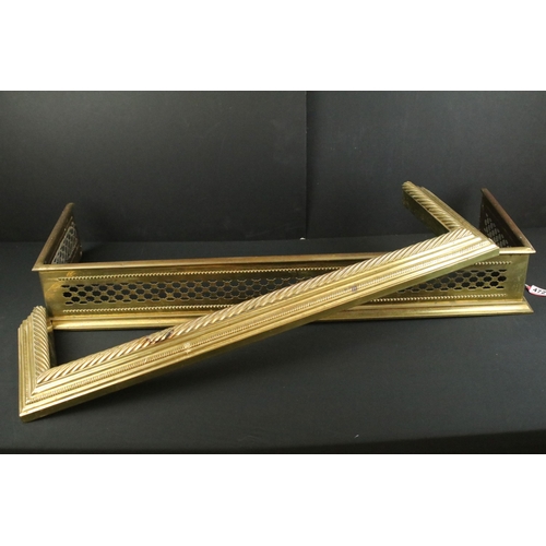 472 - Two 20th century brass fireplace fender guard surrounds, one with open work cut out design, W 102cm ... 