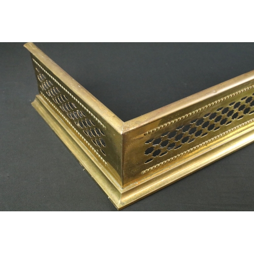 472 - Two 20th century brass fireplace fender guard surrounds, one with open work cut out design, W 102cm ... 