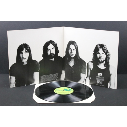 107 - Vinyl - 4 Pink Floyd LPs and a tour programme to include The Dark Side Of The Moon (French pressing)... 