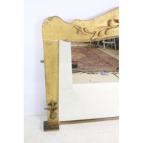 550A - Large over mantel gilded ornate footed mirror with scroll style detail to top, 92cm high, 118cm, 9cm... 