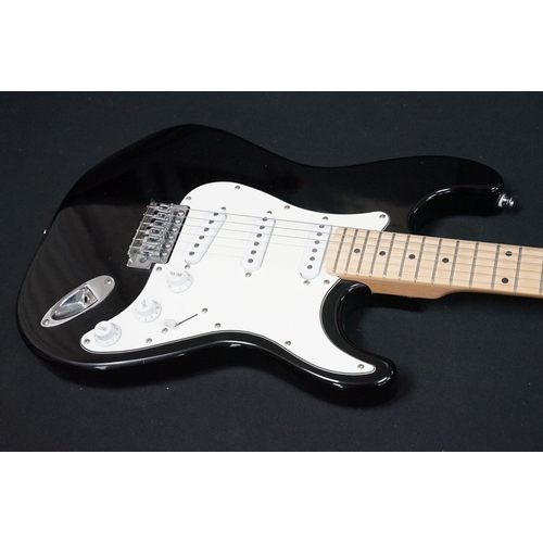 402 - Guitar - 2 stratocaster style electric guitars to include an Encore and an Elevation, both in black ... 