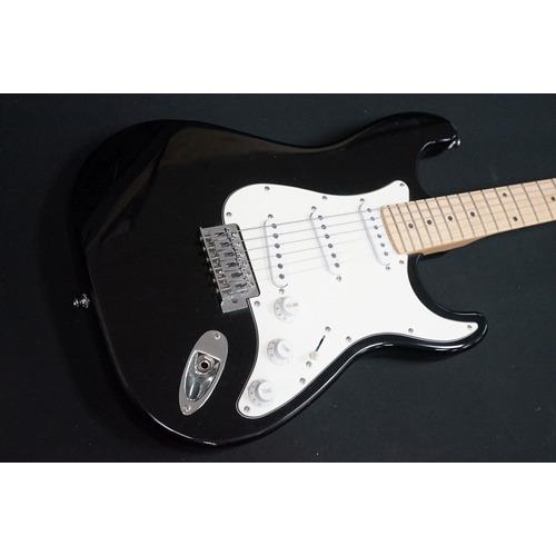 402 - Guitar - 2 stratocaster style electric guitars to include an Encore and an Elevation, both in black ... 