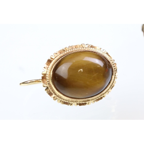 237A - Tigers eye ring and earrings jewellery suite. The lot to include a ring set with a oval tigers eye c... 