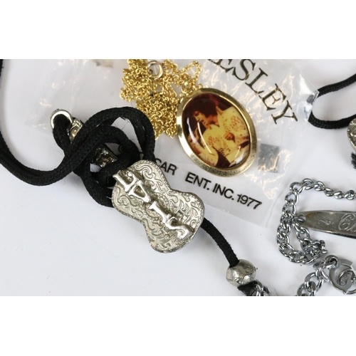 234 - A small collection of vintage Elvis Presley related costume jewellery.