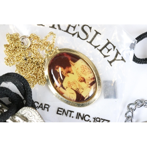 234 - A small collection of vintage Elvis Presley related costume jewellery.