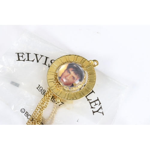 234 - A small collection of vintage Elvis Presley related costume jewellery.