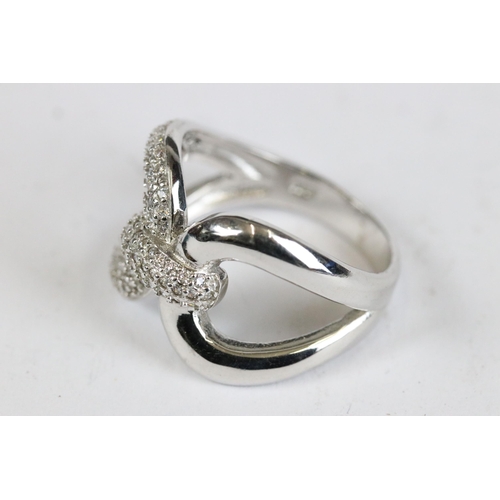 236 - Silver and CZ cross over ring