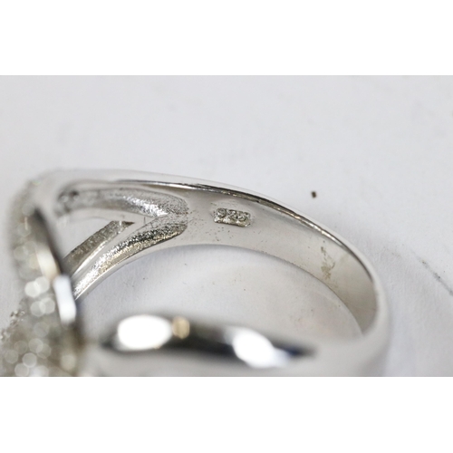 236 - Silver and CZ cross over ring