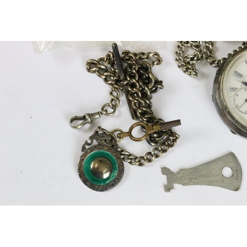 246 - Two silver cased pocket watches together with two silver albert chains and a silver vesta case.