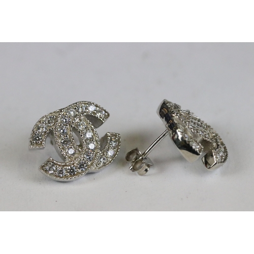 247 - Pair of silver and CZ designer style earrings cased