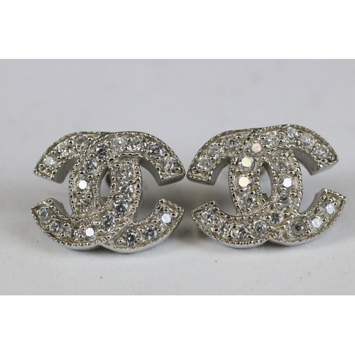 247 - Pair of silver and CZ designer style earrings cased