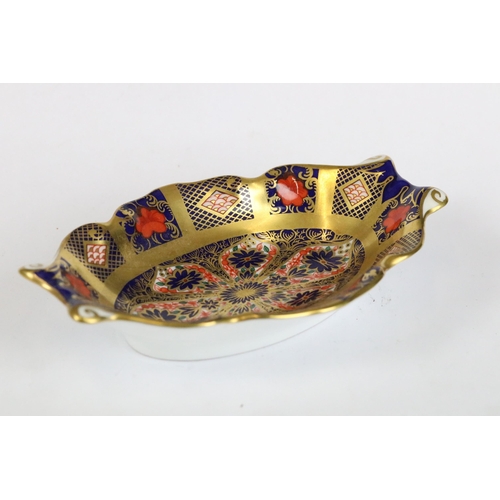 261 - A Crown Derby Imari pattern pin dish (1123) together with a Crown Derby candle snuffer (1128).