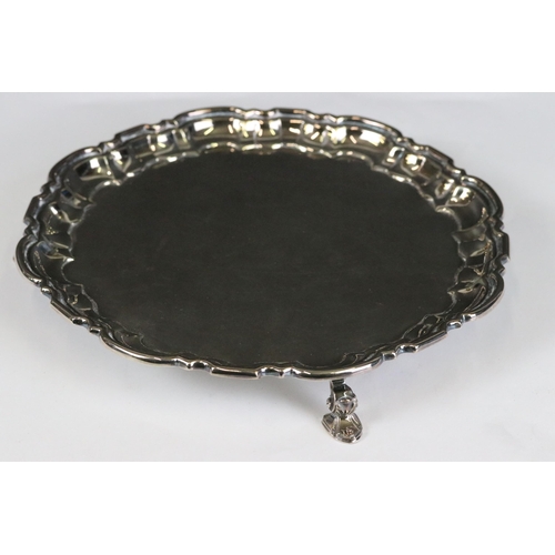 272 - A fully hallmarked sterling silver three footed card tray, assay marked for Sheffield and maker mark... 