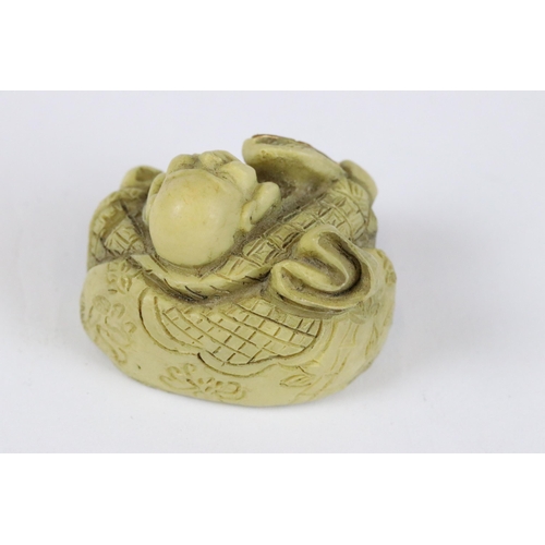 277 - A collection of Japanese carved wooden netsuke and miniature wood and resin figures.