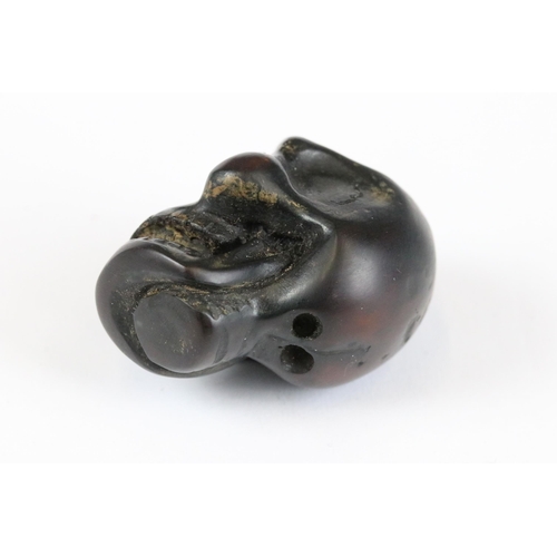 277 - A collection of Japanese carved wooden netsuke and miniature wood and resin figures.