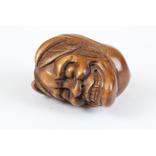 277 - A collection of Japanese carved wooden netsuke and miniature wood and resin figures.