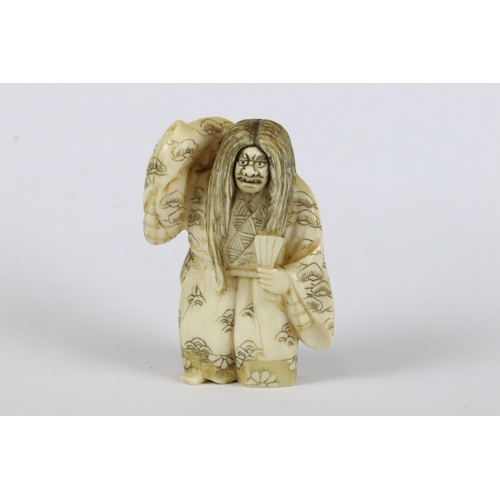 277 - A collection of Japanese carved wooden netsuke and miniature wood and resin figures.