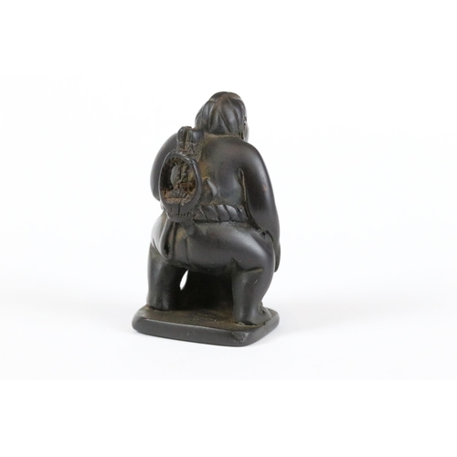 277 - A collection of Japanese carved wooden netsuke and miniature wood and resin figures.