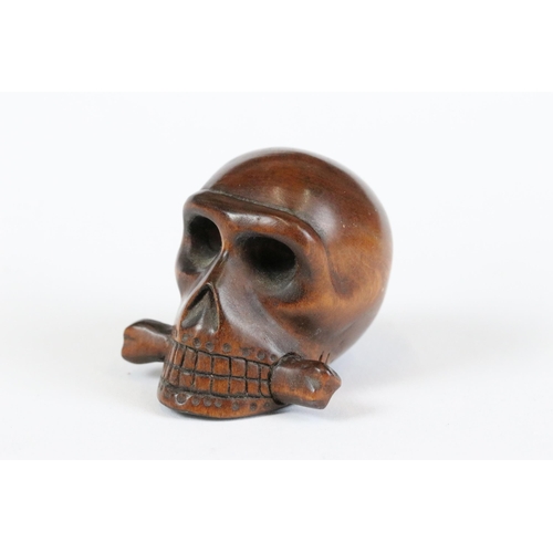 277 - A collection of Japanese carved wooden netsuke and miniature wood and resin figures.