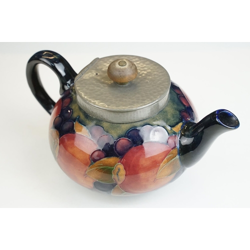 16 - Moorcroft pomegranate pattern teapot with hammered pewter hinged lid, H 12cm