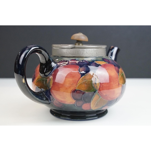 16 - Moorcroft pomegranate pattern teapot with hammered pewter hinged lid, H 12cm