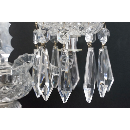 22 - Pair of Waterford crystal candelabras with centre spine and two scrolled arms with prism droplets