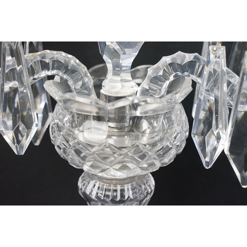 22 - Pair of Waterford crystal candelabras with centre spine and two scrolled arms with prism droplets