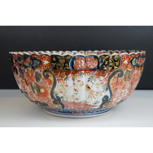 25 - Large Imari pattern scalloped gold detail bowl with decorative panels and centre butterflies, diamet... 