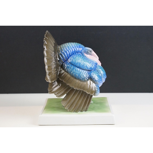 3 - Fraureuth blue painted Turkey ceramic figurine on a rectangular green plinth, marked to base, H 19cm... 