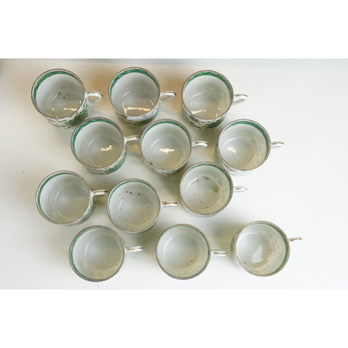 30 - Twelve Chinese green and gold style coffee cups and saucers