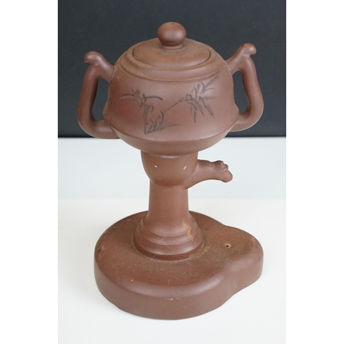 32 - Terracotta Chinese teapot with bamboo motif and six small cups, marked to base together with four Ch... 