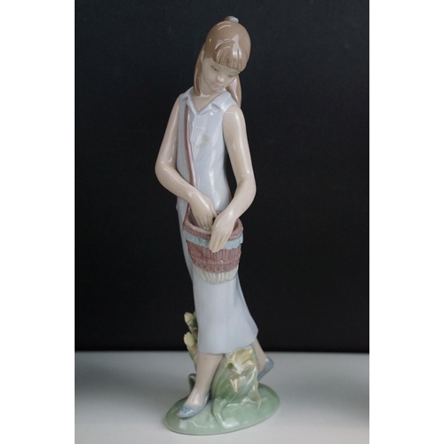 39 - Selection of figurines to include Lladro 2007 annual piece girl with bag, girl with bouquet, Nao exa... 