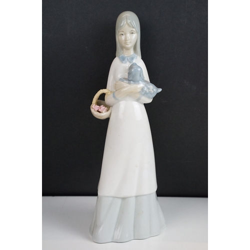 39 - Selection of figurines to include Lladro 2007 annual piece girl with bag, girl with bouquet, Nao exa... 