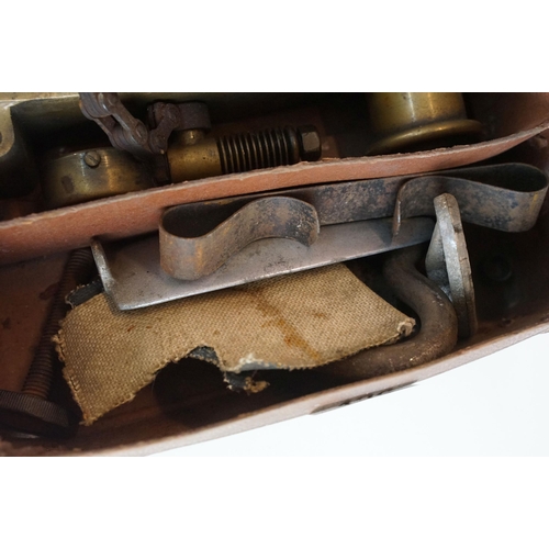 426 - Small leather case containing antique car accessories to include a car vulcaniser with gauge, tax di... 