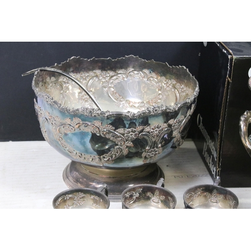 448A - Large ornate silver plated punch bowl with six punch cups and pouring ladle together with a Leonard ... 