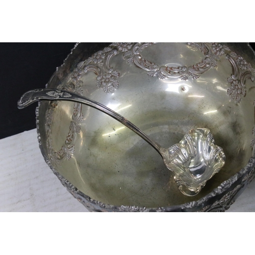 448A - Large ornate silver plated punch bowl with six punch cups and pouring ladle together with a Leonard ... 