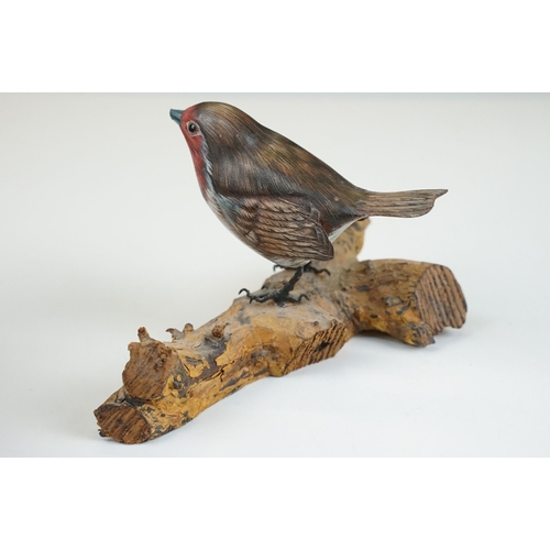 45 - Bird figurines to include Song Thrush and English Robin on wooden branch examples, signed to base, t... 