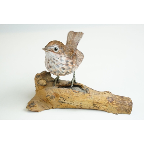 45 - Bird figurines to include Song Thrush and English Robin on wooden branch examples, signed to base, t... 