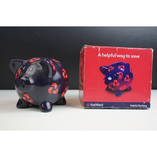 57 - Natwest Wade piggy bank collection of six characters with stoppers an all over print example