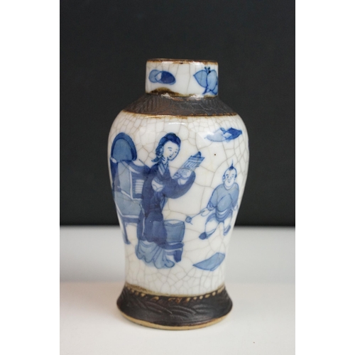 62 - Blue and white lidded ceramic box with embossed metal detail together with a blue and white vase wit... 