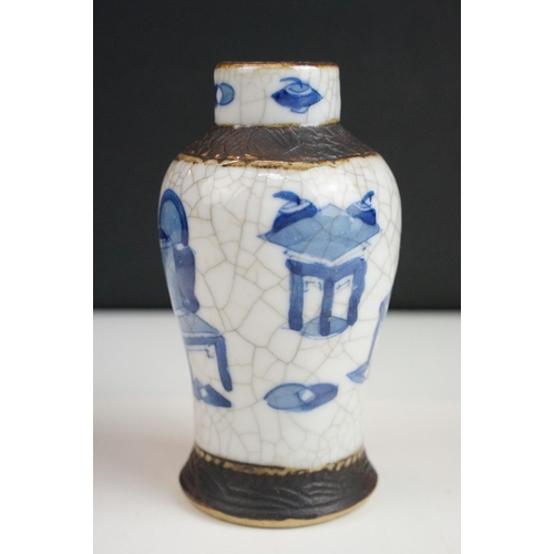 62 - Blue and white lidded ceramic box with embossed metal detail together with a blue and white vase wit... 