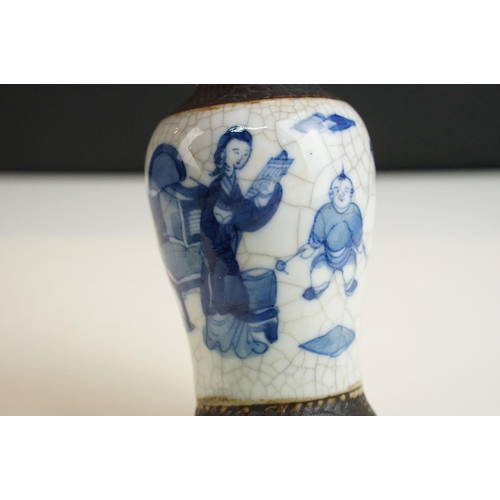 62 - Blue and white lidded ceramic box with embossed metal detail together with a blue and white vase wit... 