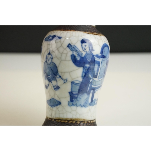 62 - Blue and white lidded ceramic box with embossed metal detail together with a blue and white vase wit... 