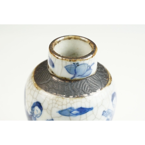 62 - Blue and white lidded ceramic box with embossed metal detail together with a blue and white vase wit... 